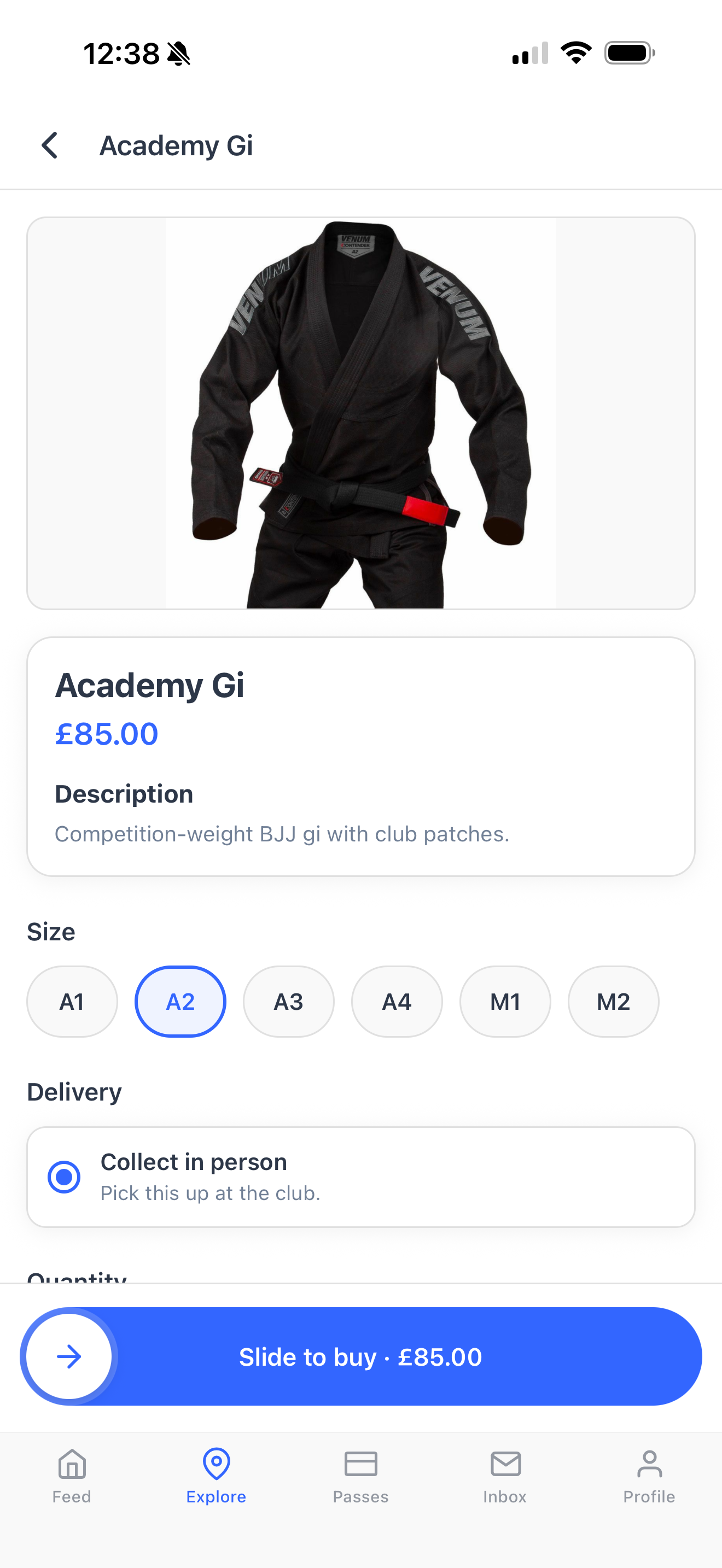 A club shop product page for an Academy Gi in the Dyno member app, with size options and slide-to-buy checkout